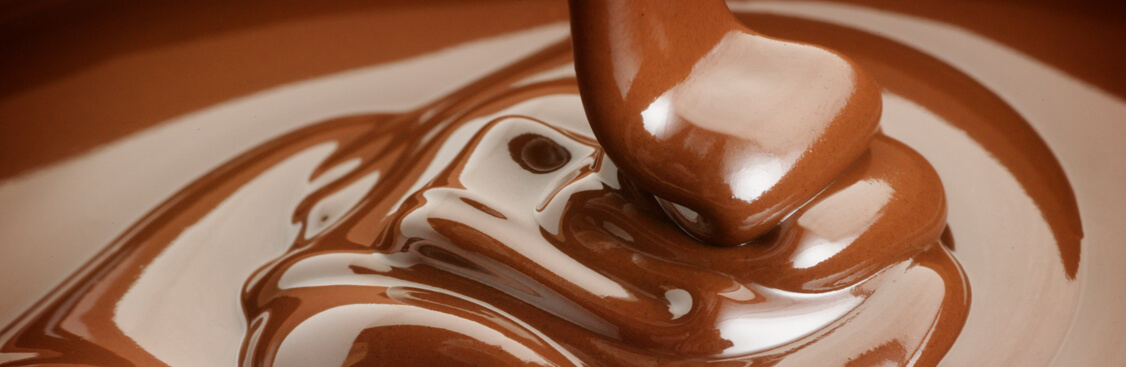 Close-up of streaming melted milk chocolate