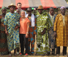 Group of adults mostly wearing traditional African attire