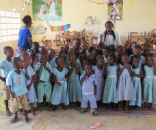 Classroom photo of young children with teachers