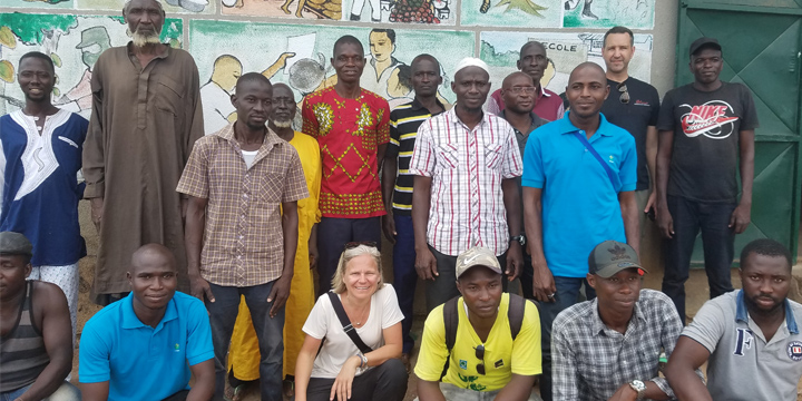Blommer representative skaking hands with farmers