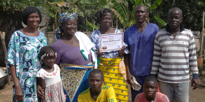 Group of farmers posing with Blommer certificate